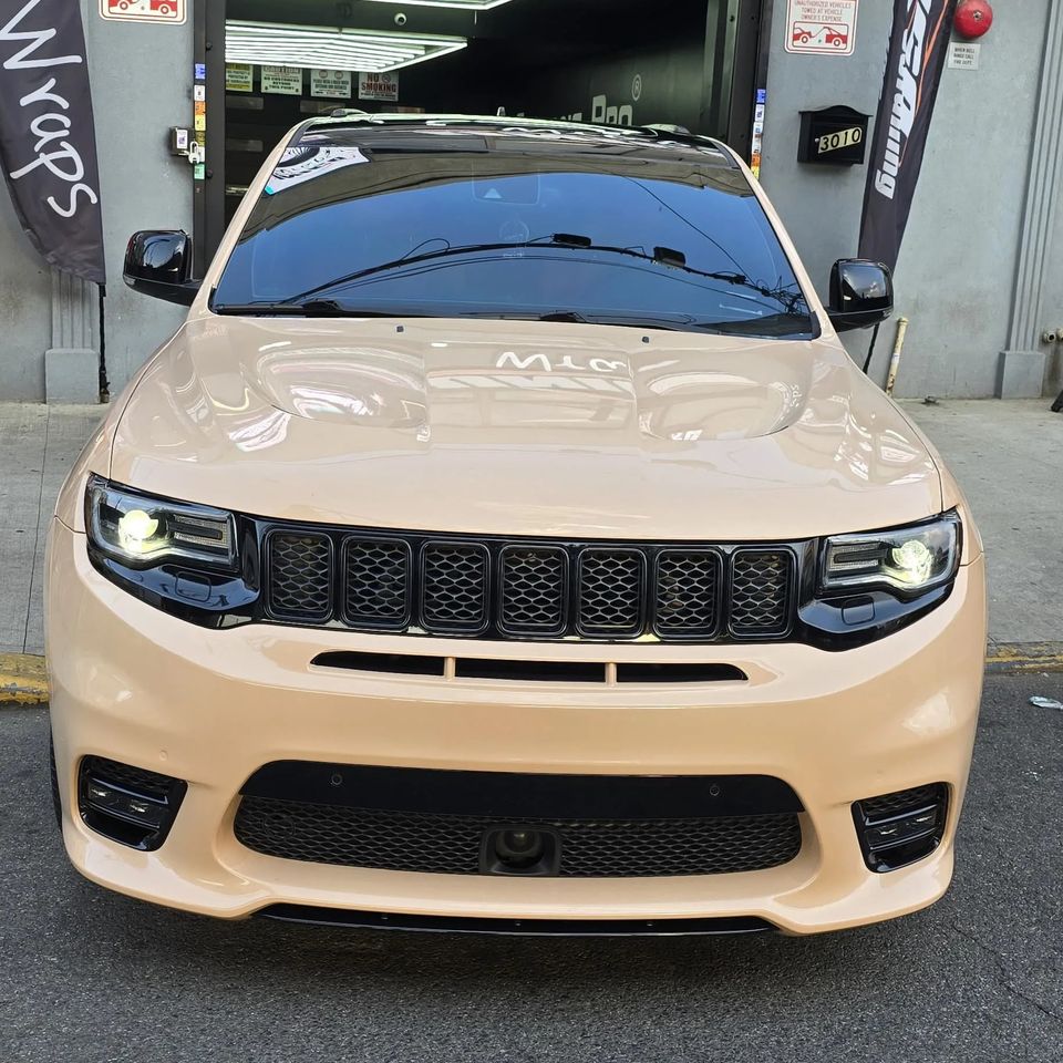 Professionally detailed beige Jeep Grand Cherokee SUV