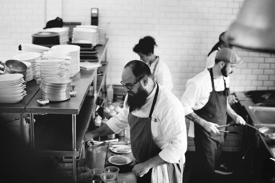Group chefs working kitchen
