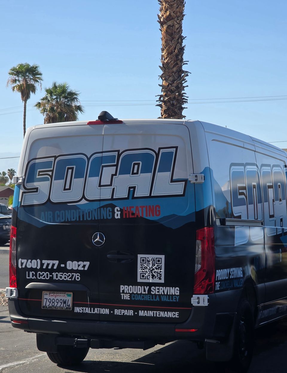 Rear view of a SoCal Air Conditioning & Heating Mercedes Sprinter service van with company branding, phone number, QR code, and Coachella Valley service information parked beneath palm trees in Southern California.