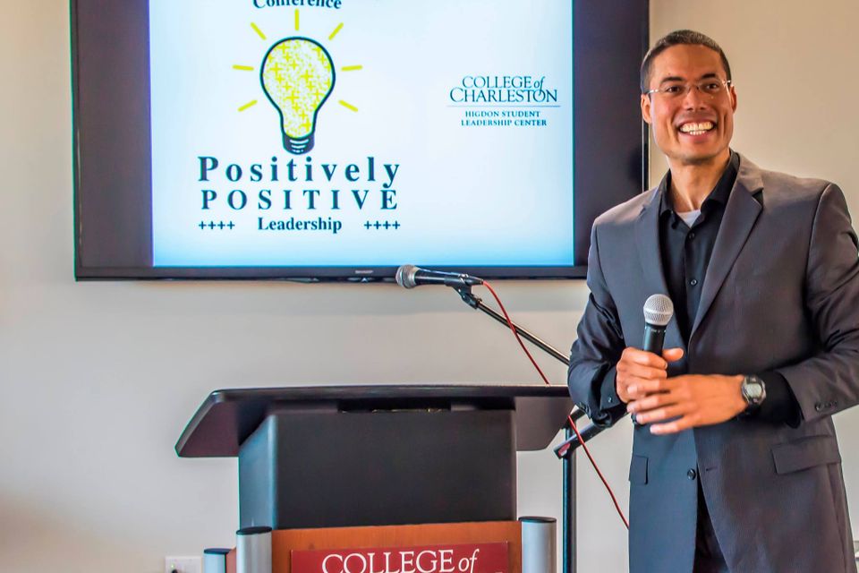 Action shot motivational presentation speaking college student leadership conference