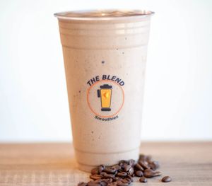 Mocha-Craze smoothie made with almond milk, cocoa powder, frozen yogurt, coffee, and topped with chocolate drizzle.