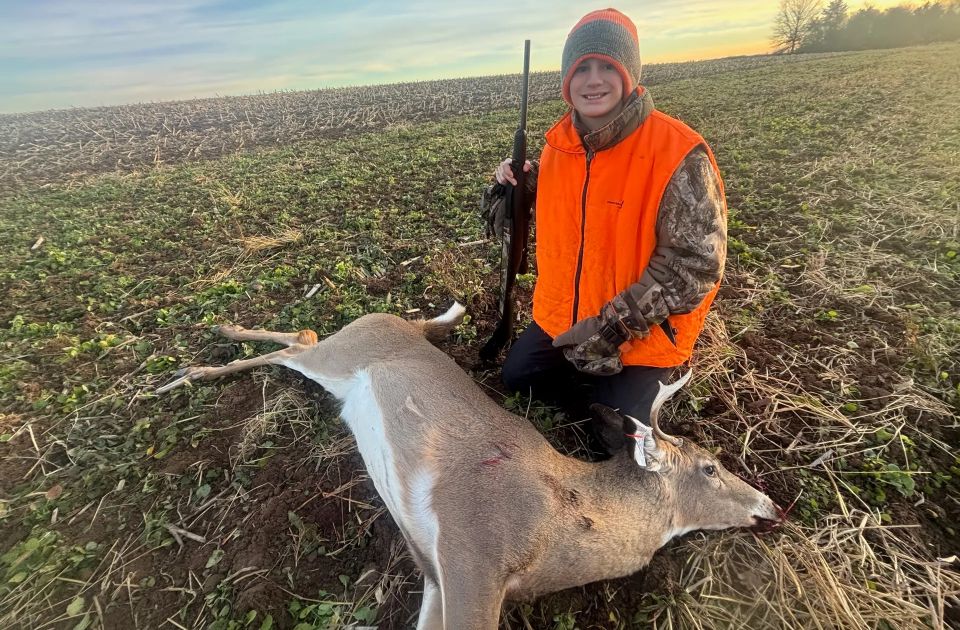 Gabe and his buck 2025. Photo by Jake Boyer