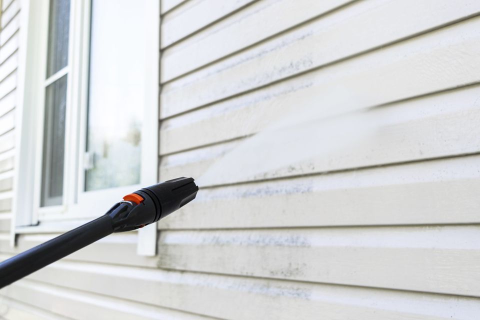 Importance of pressure washing before painting your house