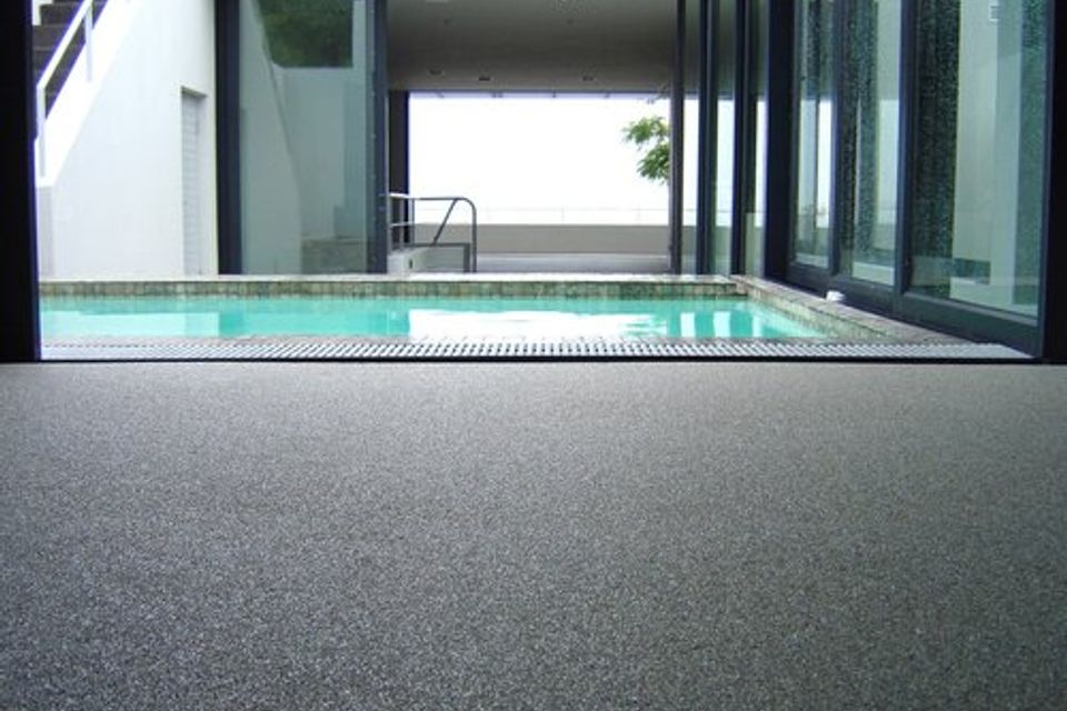 Indoor pool area featuring Quartz Carpet flooring with a textured, slip-resistant surface.