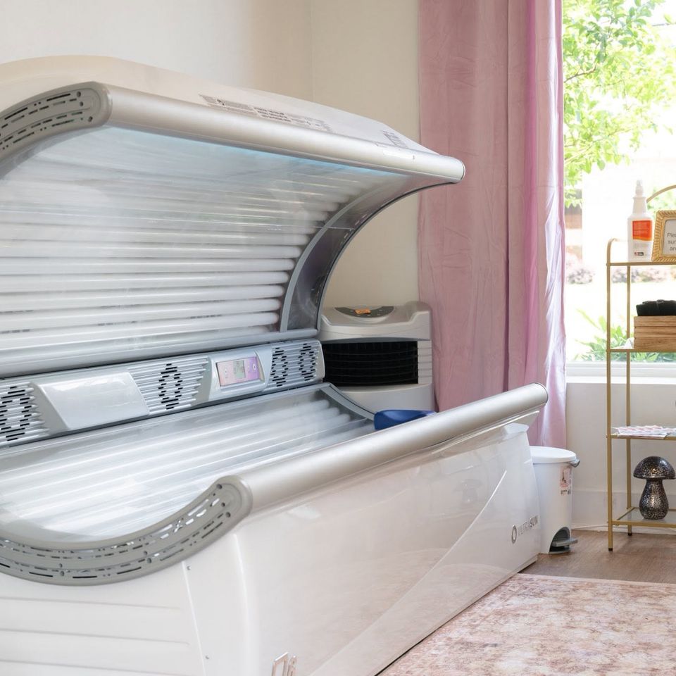 Open tanning bed in a tanning room at the salon in Columbiana AL
