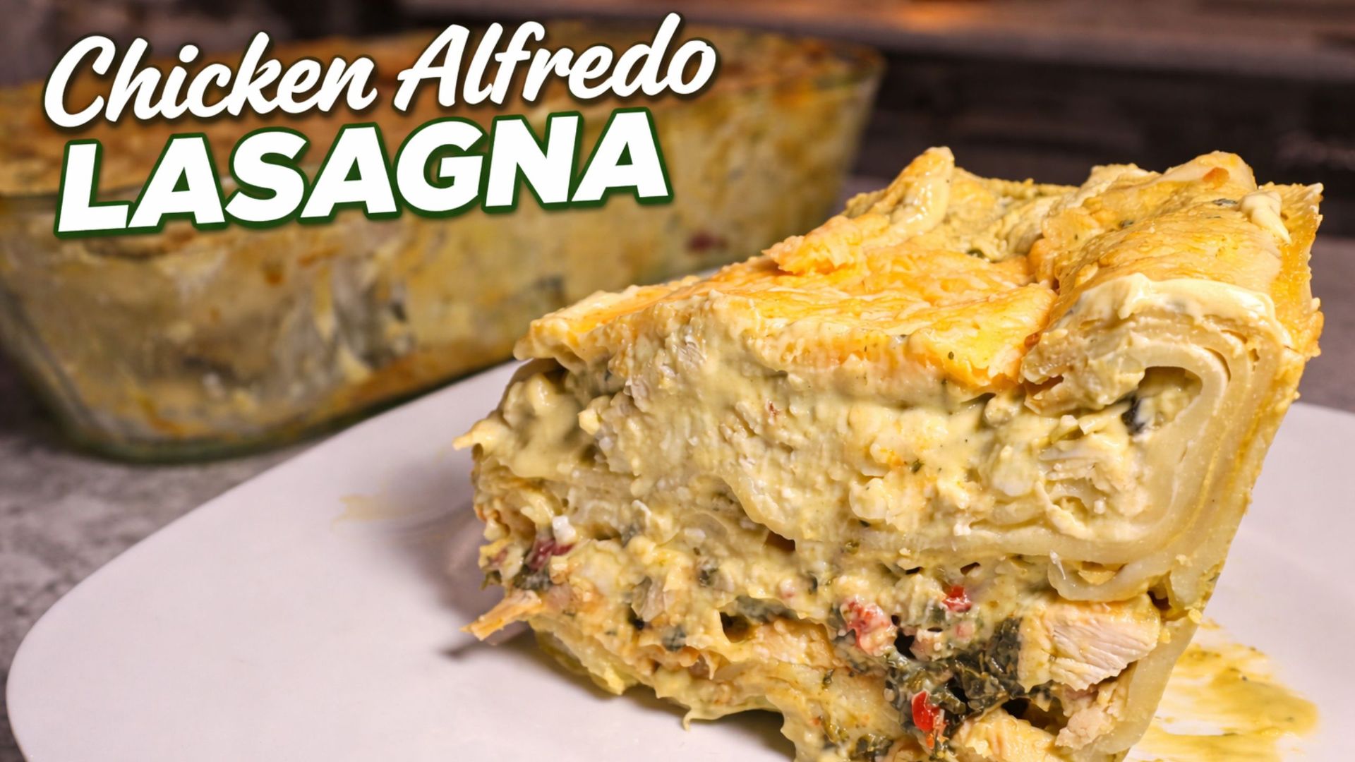 White Chicken Alfredo Lasagna with creamy pesto alfredo sauce on a white plate