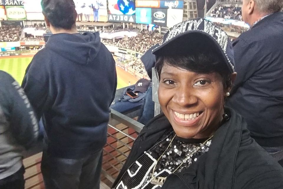 Dee   host of everlasting love podcast  eating popcorn  at  yankee stadium   bronx  ny 