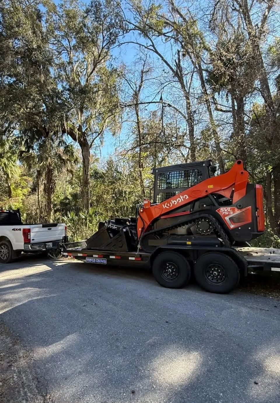 JNJ Hauling Kubota being transported