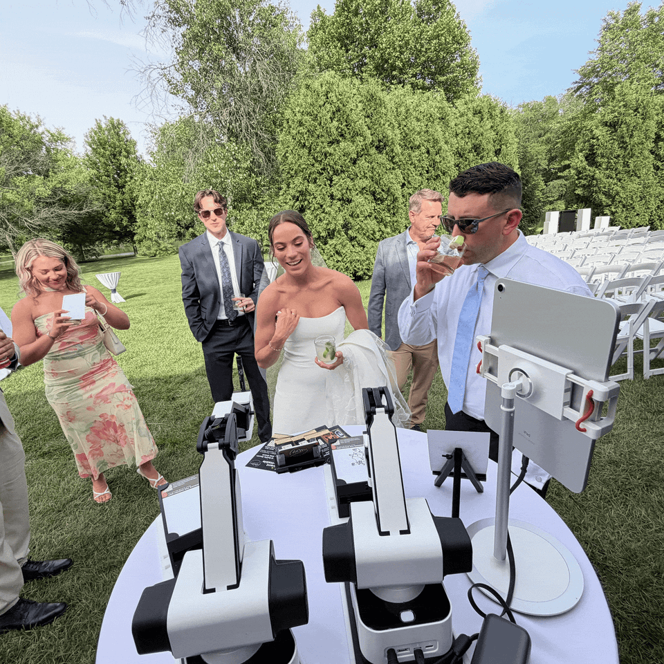 Robotic arms showcasing the AI Sketch Bot experience at a wedding, creating instant digital sketches for guests.