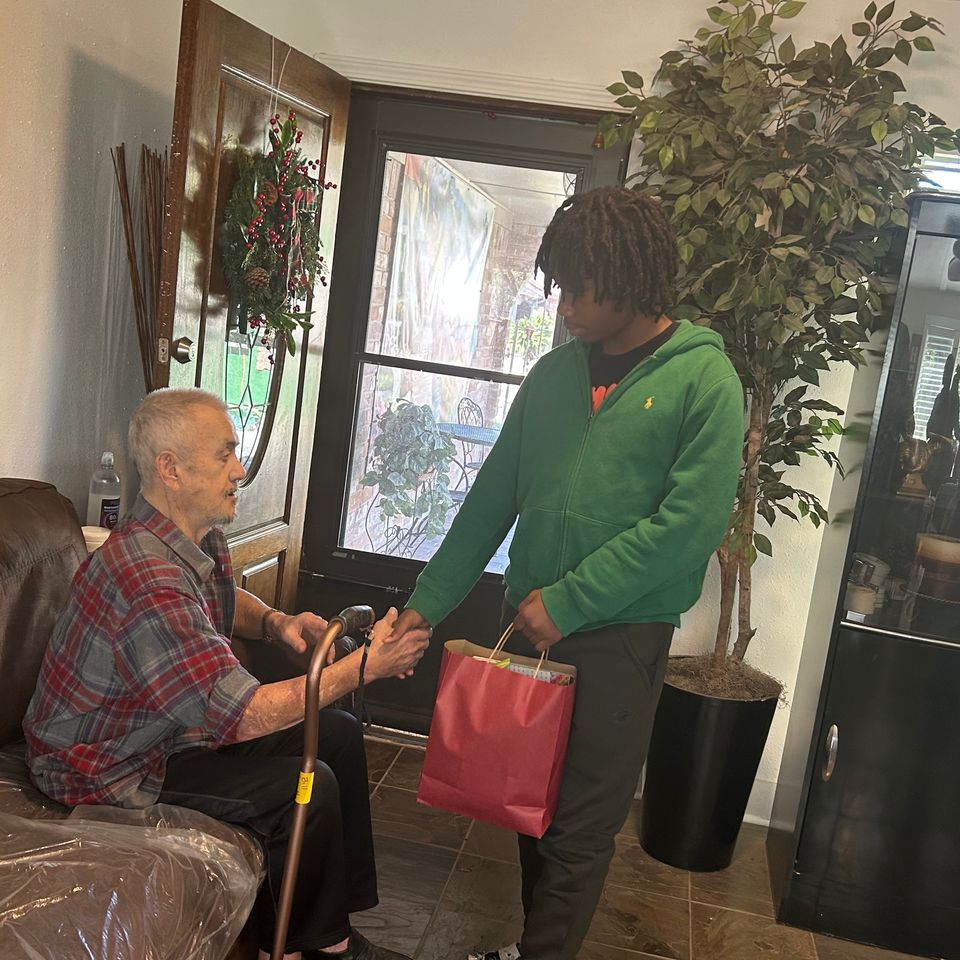Christmas giving by a group of youth at Hour Care transitional living home or group home in Houston, TX.