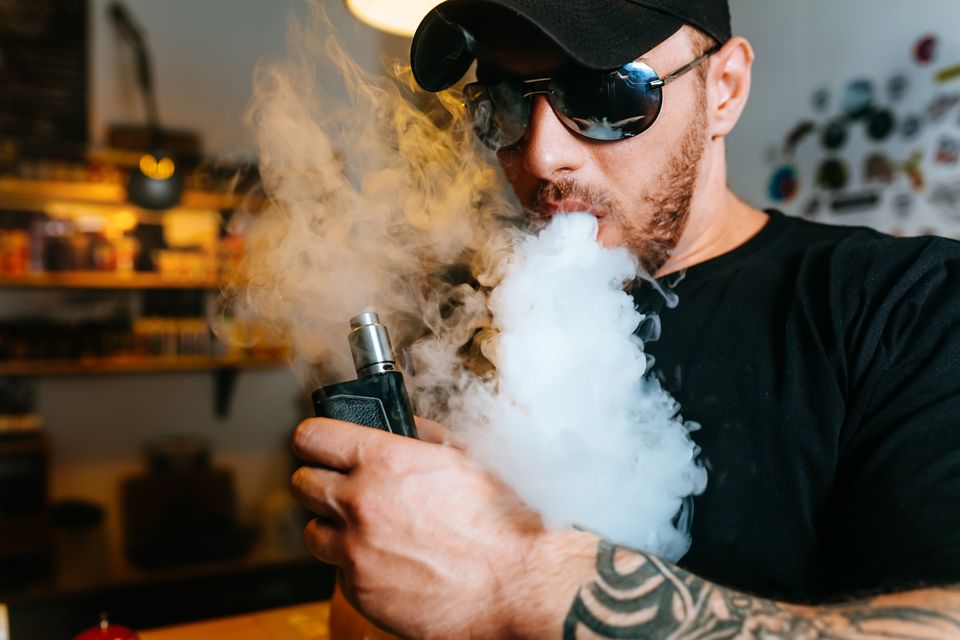 Vecteezy brutal bearded man in sunglasses smoke an electronic 42347932