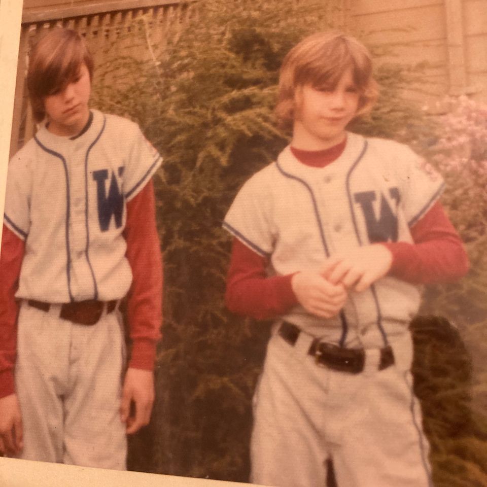 Peter and brian in little league uniforms