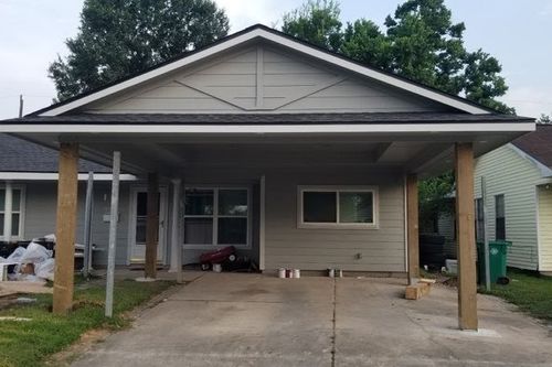Front‑elevation carport addition nearing completion in The Woodlands, TX
