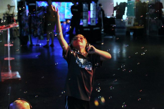 Child playing with bubbles