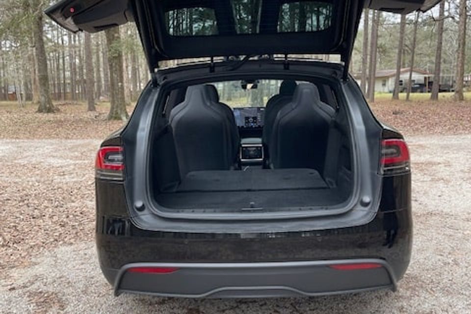 Tesla model x   rear hatch open and seats down   further away min