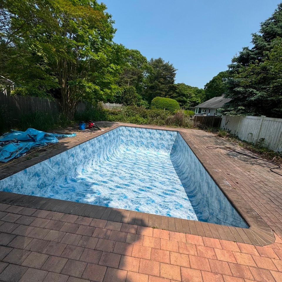 Rectangular inground pool with new marbled liner and brick paver patio in Long Island NY