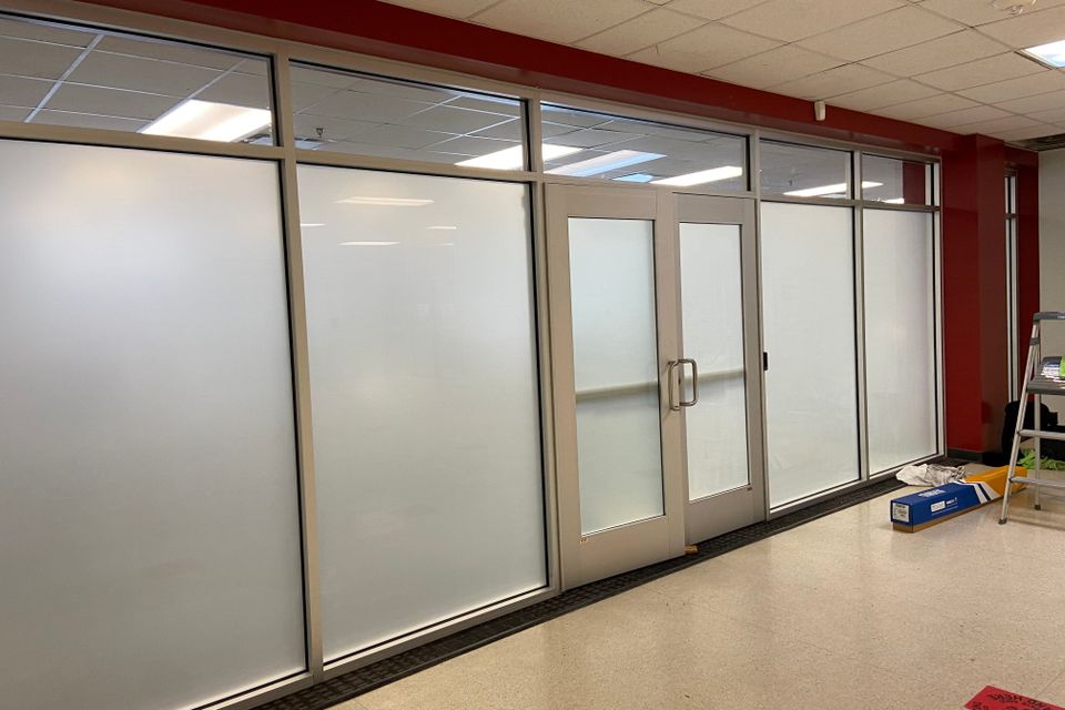 Frosted privacy window film installed in commercial conference room in Sugar Land TX