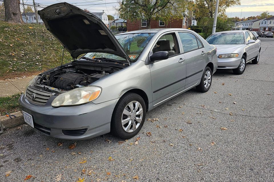 Silver toyota corolla