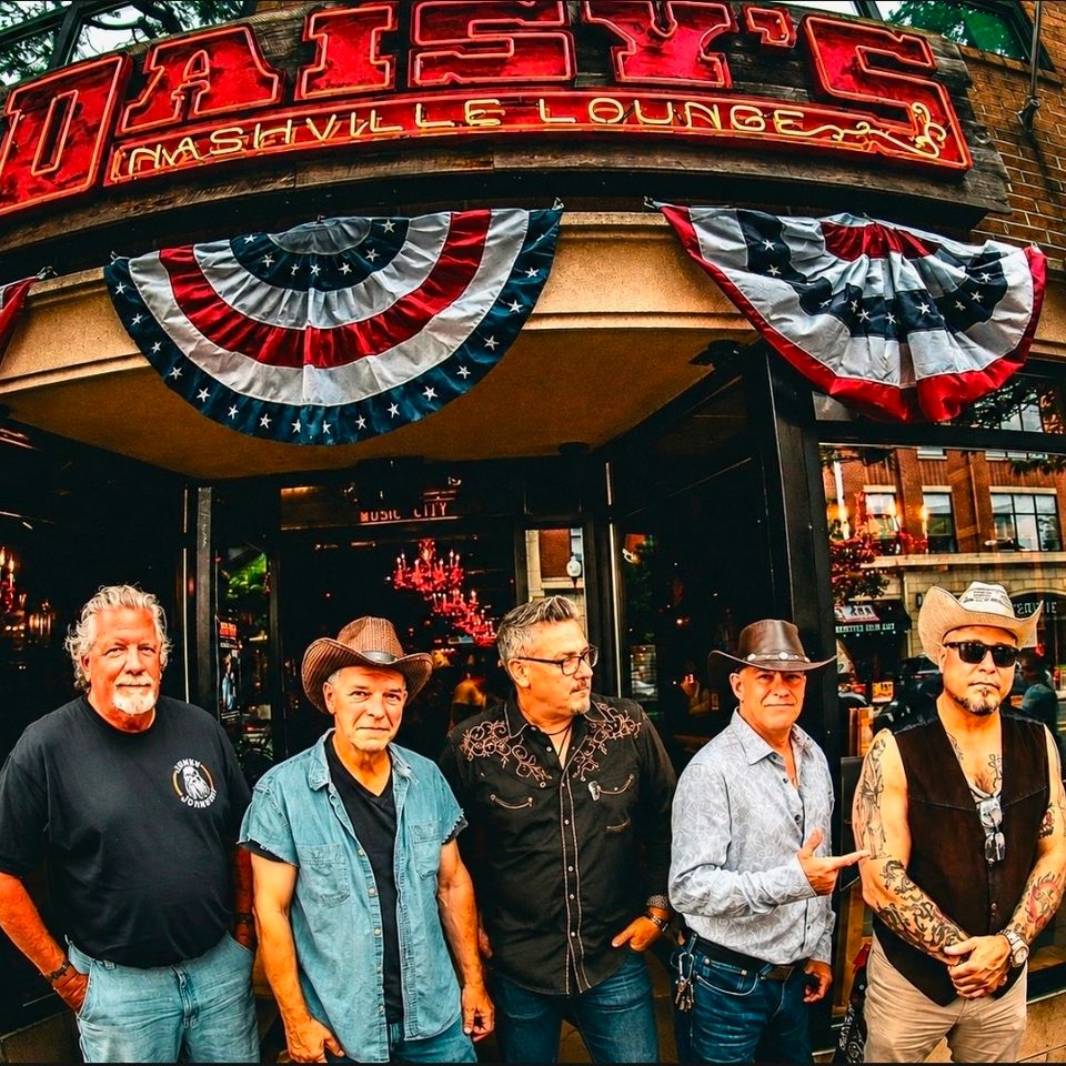 Roadside band posing outside Daisy's Nashville lounge before a performance