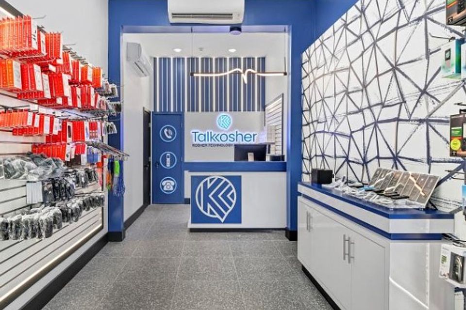 Custom retail shelving solutions for a technology store by Ultimate Kitchens.