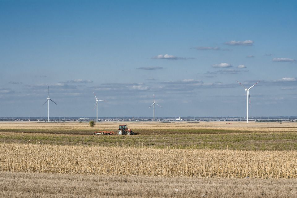 View of a tractor on a dried field under the blue 2026 01 07 06 32 58 utc