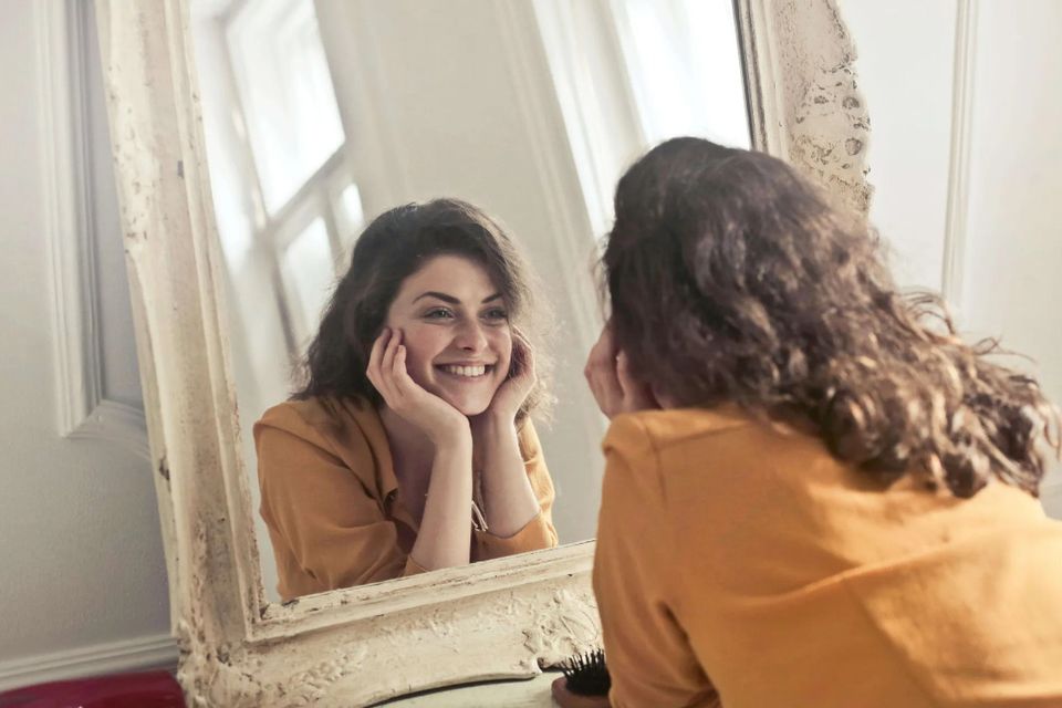Self-compassion looking in mirror