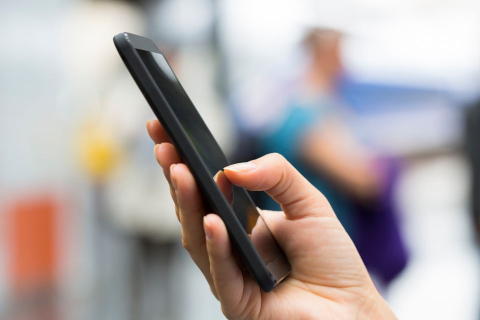Person using a cell phone depositphotos 33103675 l