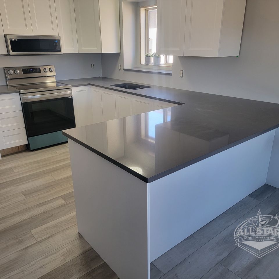 Dark stone kitchen island with custom countertop installation in Houston, TX