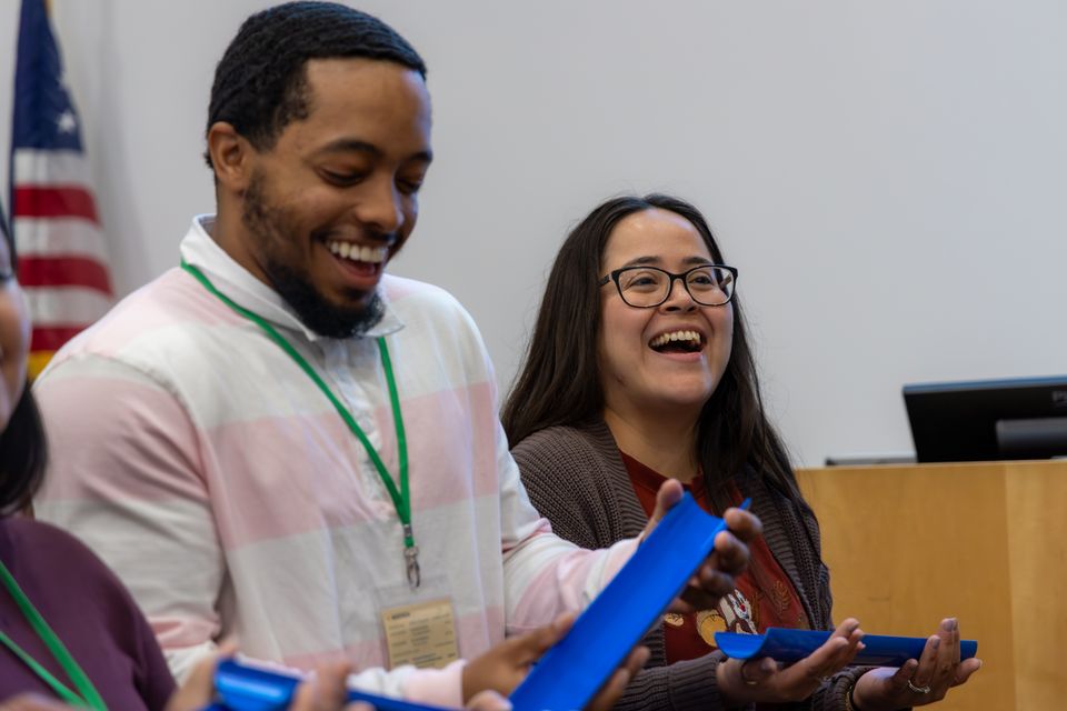 Man and woman standing laughing