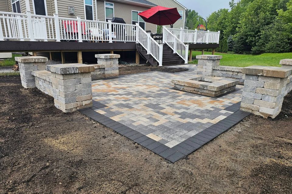 Hardscaping work, including a fire pit, installed by Vic's Landscaping