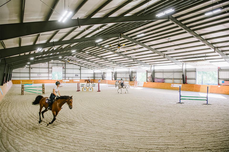 Indoor outdoor riding arenas