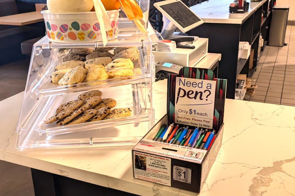 At a coffee shop, full of pens great location part-time vending business