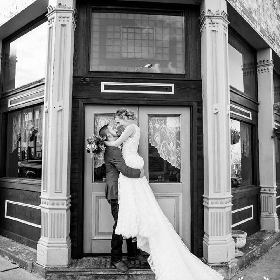 groom picking up bride at The Coleman Vault