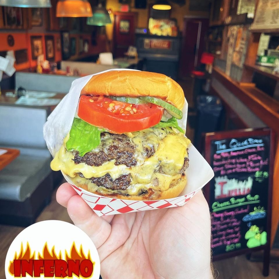 Savory 2 patty cheeseburger with lettuce and tomato at Inferno The Restaurant in Sound Beach