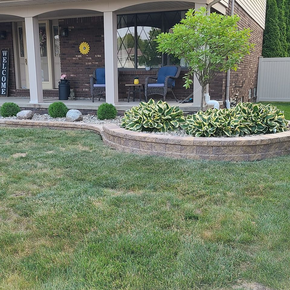 Plants and lawn that is maintained by Vic's Landscaping