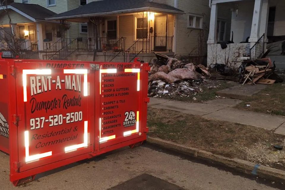 Rent-A-Man Dumpster Rentals dumpster placed outside a home for a residential cleanout.