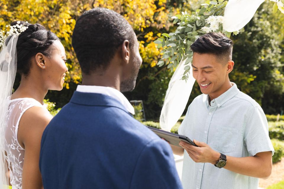 Wedding officiant performing custom ceremony for couple