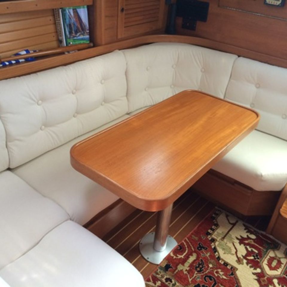 C shaped bench around table below deck