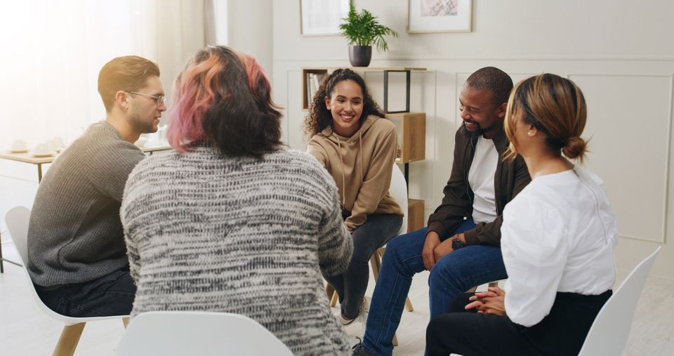 Adults sharing insights at the end of an experiential leadership development workshop