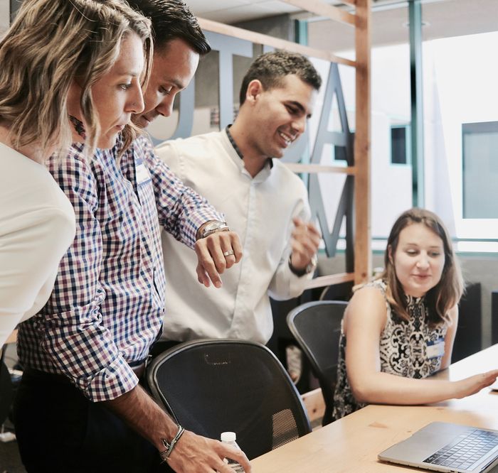 Business owners meeting with an adviser to review paperwork