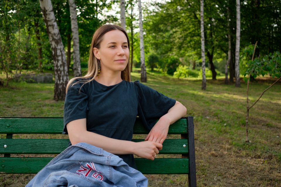 Young woman relaxing park sitting chair