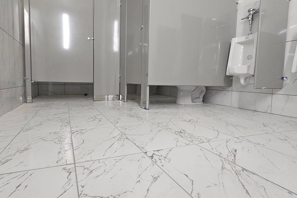 Silver bathroom partitions done by Pabst Leyton in Southern California