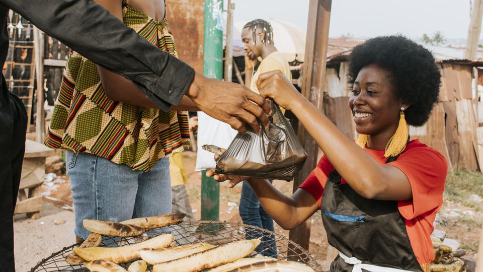 Close up happy woman selling food min