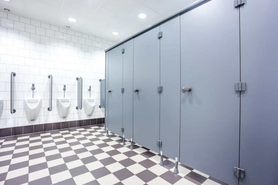 Vistacreate 183657842 stock photo urinal and toilet doors