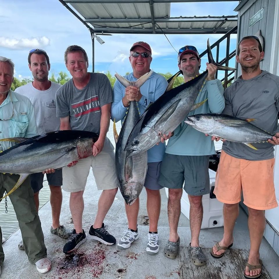 Group of men holding up the fish they caught on a charter in Venice, La.