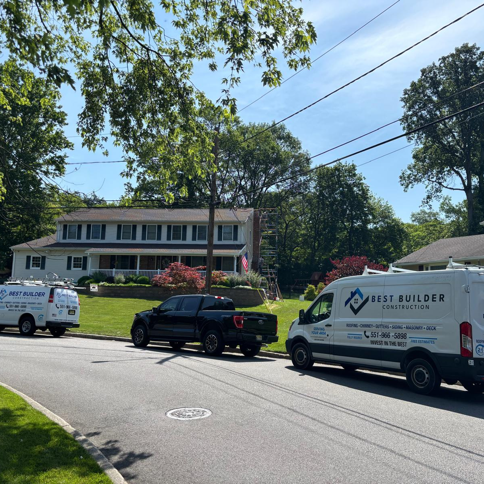 Best Builder Construction Contractor trucks on street in front of homes