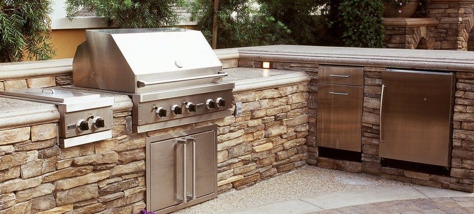 Kitchen stunning outdoor kitchens design ideas with modern aluminum material fencing and beautiful trees area in the garden exciting outdoor stained concrete countertops design inspirations20151206 13584 1jzm955