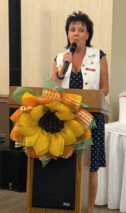 Speaker addressing attendees at the Mahoning Valley September meeting from a podium.