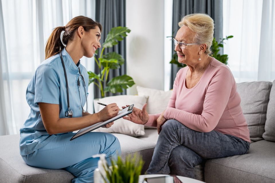 Vistacreate 470098184 stock photo female doctor supporting senior patient home visit doctor discussing coronavirus