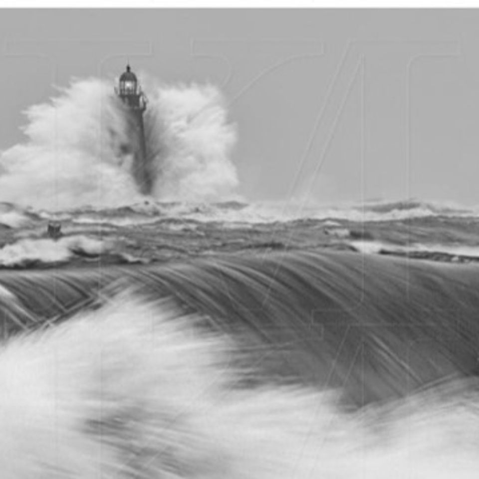 Lighthouse waves crashing